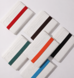 crinkled white-leather notebook with bold spine stripe